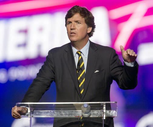 December 19, 2021 - Phoenix, Arizona, USA - Fox News host TUCKER CARLSON speaks at AmericaFest, a Turning Point USA event. Phoenix USA - ZUMAce6_ 20211219_zaf_ce6_013 Copyright: xBrianxCahnx