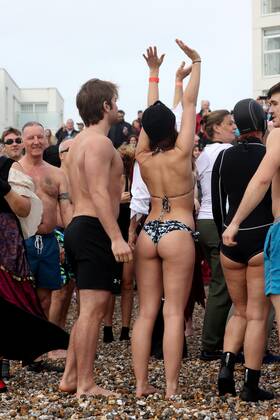 Over 350 New Year revellers, many in fancy dress, take part in the New Year Big Dip at East Wittering Beach in Chichester, West Sussex. More than double the previous record number of people took part, making the most of the warmest New YearÕs Day on record in the UK. JANUARY 1st 2022  MTXx2201