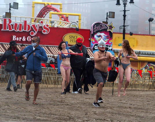 January 1, 2022, New York, New York, USA: January 1, 2022 New York , Coney Island Polar Bear Plunge. This year the Polar Bear Plunge returned after last year s Covid outbreak. Revelers enjoy the water. New York USA - ZUMAct2_ 20220101_zaf_ct2_034 Copyright: xBrucexCotlerx