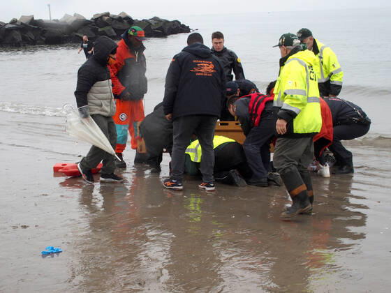 January 1, 2022, New York, New York, USA: January 1, 2022 New York , Coney Island Polar Bear Plunge. This year the Polar Bear Plunge returned after last year s Covid outbreak. Revelers enjoy the water..Participant prior to massive cardiac event and Emergency medical personnel try and revive him before transporting him to area hospital. New York USA - ZUMAct2_ 20220101_zaf_ct2_087 Copyright: xBrucexCotlerx
