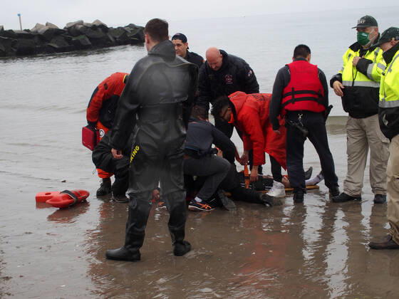 January 1, 2022, New York, New York, USA: January 1, 2022 New York , Coney Island Polar Bear Plunge. This year the Polar Bear Plunge returned after last year s Covid outbreak. Revelers enjoy the water..Participant prior to massive cardiac event and Emergency medical personnel try and revive him before transporting him to area hospital. New York USA - ZUMAct2_ 20220101_zaf_ct2_089 Copyright: xBrucexCotlerx