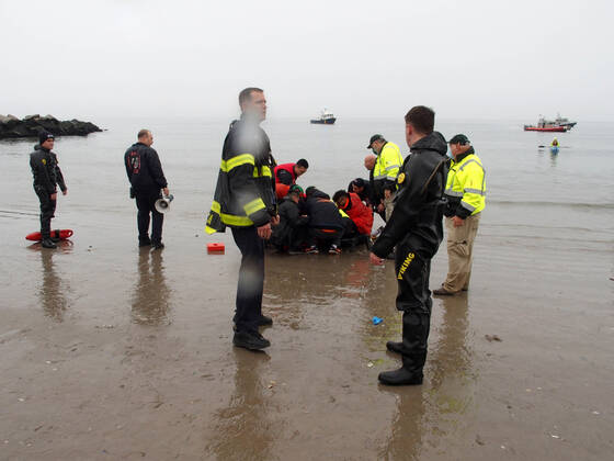 January 1, 2022, New York, New York, USA: January 1, 2022 New York , Coney Island Polar Bear Plunge. This year the Polar Bear Plunge returned after last year s Covid outbreak. Revelers enjoy the water..Participant prior to massive cardiac event and Emergency medical personnel try and revive him before transporting him to area hospital. New York USA - ZUMAct2_ 20220101_zaf_ct2_090 Copyright: xBrucexCotlerx