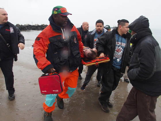 January 1, 2022, New York, New York, USA: January 1, 2022 New York , Coney Island Polar Bear Plunge. This year the Polar Bear Plunge returned after last year s Covid outbreak. Revelers enjoy the water..Participant prior to massive cardiac event and Emergency medical personnel try and revive him before transporting him to area hospital. New York USA - ZUMAct2_ 20220101_zaf_ct2_092 Copyright: xBrucexCotlerx