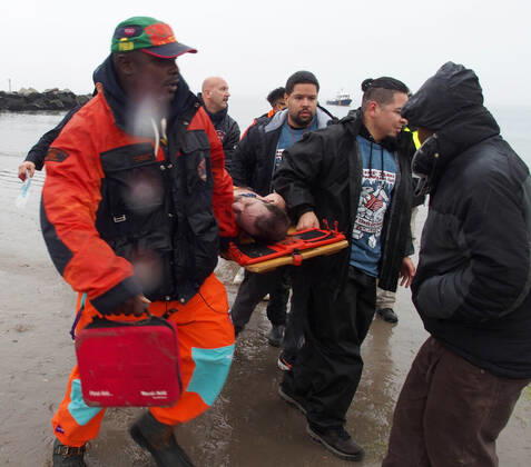 January 1, 2022, New York, New York, USA: January 1, 2022 New York , Coney Island Polar Bear Plunge. This year the Polar Bear Plunge returned after last year s Covid outbreak. Revelers enjoy the water..Participant prior to massive cardiac event and Emergency medical personnel try and revive him before transporting him to area hospital. New York USA - ZUMAct2_ 20220101_zaf_ct2_093 Copyright: xBrucexCotlerx