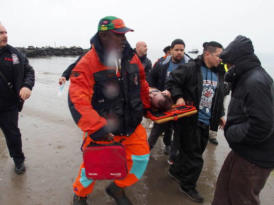January 1, 2022, New York, New York, USA: January 1, 2022 New York , Coney Island Polar Bear Plunge. This year the Polar Bear Plunge returned after last year s Covid outbreak. Revelers enjoy the water..Participant prior to massive cardiac event and Emergency medical personnel try and revive him before transporting him to area hospital. New York USA - ZUMAct2_ 20220101_zaf_ct2_094 Copyright: xBrucexCotlerx