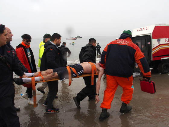 January 1, 2022, New York, New York, USA: January 1, 2022 New York , Coney Island Polar Bear Plunge. This year the Polar Bear Plunge returned after last year s Covid outbreak. Revelers enjoy the water..Participant prior to massive cardiac event and Emergency medical personnel try and revive him before transporting him to area hospital. New York USA - ZUMAct2_ 20220101_zaf_ct2_096 Copyright: xBrucexCotlerx