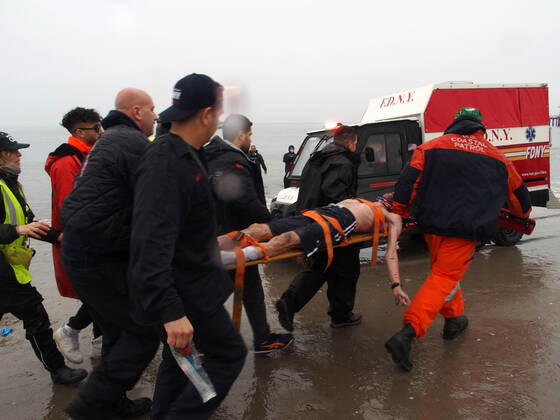 January 1, 2022, New York, New York, USA: January 1, 2022 New York , Coney Island Polar Bear Plunge. This year the Polar Bear Plunge returned after last year s Covid outbreak. Revelers enjoy the water..Participant prior to massive cardiac event and Emergency medical personnel try and revive him before transporting him to area hospital. New York USA - ZUMAct2_ 20220101_zaf_ct2_098 Copyright: xBrucexCotlerx