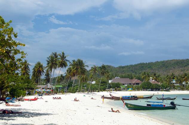 Ko Phi Phi consists of two islands, Phi Phi Leh and Phi Phi Don, located southeast of Phuket. Both are part of Hat Noppharat Thara Ko Phi Phi National Marine Park.<br ><br > Set in the centre of the Sea of Phuket, Ko Phi Phi is almost equidistant from Phuket and Krabi and can be reached by boat in around two hours.<br ><br > Phi Phi Don is the larger of the two islands, with scenic hills, steep cliffs, silken beaches, azure waters and remarkable bird- and sea-life. The island narrows at the middle where long, white-sand beaches are only a few hundred metres apart. Boats from Krabi and Phuket dock at Ao Ton Sai on the southern side of the island. Hat Yao or Long Beach faces south and is famous for the good snorkelling to be had on its co CPAxMediaxCo.xLtd. 1060_14_CPA0014901