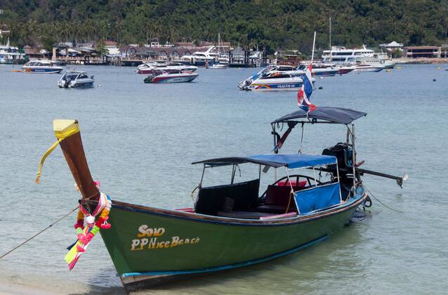 Ko Phi Phi consists of two islands, Phi Phi Leh and Phi Phi Don, located southeast of Phuket. Both are part of Hat Noppharat Thara Ko Phi Phi National Marine Park.<br ><br > Set in the centre of the Sea of Phuket, Ko Phi Phi is almost equidistant from Phuket and Krabi and can be reached by boat in around two hours.<br ><br > Phi Phi Don is the larger of the two islands, with scenic hills, steep cliffs, silken beaches, azure waters and remarkable bird- and sea-life. The island narrows at the middle where long, white-sand beaches are only a few hundred metres apart. Boats from Krabi and Phuket dock at Ao Ton Sai on the southern side of the island. Hat Yao or Long Beach faces south and is famous for the good snorkelling to be had on its co CPAxMediaxCo.xLtd. 1060_14_CPA0014902