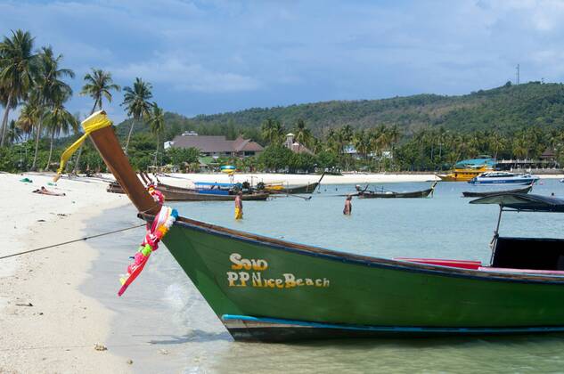 Ko Phi Phi consists of two islands, Phi Phi Leh and Phi Phi Don, located southeast of Phuket. Both are part of Hat Noppharat Thara Ko Phi Phi National Marine Park.<br ><br > Set in the centre of the Sea of Phuket, Ko Phi Phi is almost equidistant from Phuket and Krabi and can be reached by boat in around two hours.<br ><br > Phi Phi Don is the larger of the two islands, with scenic hills, steep cliffs, silken beaches, azure waters and remarkable bird- and sea-life. The island narrows at the middle where long, white-sand beaches are only a few hundred metres apart. Boats from Krabi and Phuket dock at Ao Ton Sai on the southern side of the island. Hat Yao or Long Beach faces south and is famous for the good snorkelling to be had on its co CPAxMediaxCo.xLtd. 1060_14_CPA0014903