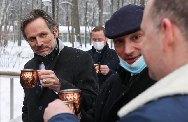 MOSCOW REGION, RUSSIA â€“ JANUARY 6, 2022: The German Chancellor s foreign and security policy adviser Jens Plotner (L) enjoys a hot drink in Arkhangelskoye museum estate before Normandy format talks with Deputy Chief of Staff of Russiaâ€™s Presidential Executive Office Dmitry Kozak (not pictured) and the French president s diplomatic advisor Emmanuel Bonne (C back). The talks will discuss Ukraine crisis de-escalation and strengthening strategic stability in Europe. Sergei Bobylev TASS  TS11E244