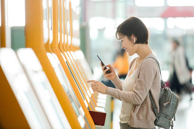 Business lady in the airport to use automatic machines China, 12 04 2019, model released, Copyright: xViewxStockx, cpmh-185280f10w.jpg, Travel,Business Travel,Business,Businesswoman,Airport,Women,Beauty,Ticket Machine,Automated,Buying,Convenience,Airport Lounge,Lobby,china,One Person,Holding,Headphones,Mobile Phone,Internet,Cursor,Visual Screen,Tourist,Business Person,White Collar Worker,Journey,back pack,East Asia,Oriental Ethnicity,Adult,People,Chinese Ethnicity,Asian and Indian Ethnicities,Indoors,Day,Horizontal,Photography,Color Image,Asia,Tourism,Air Transport Building,Young Adult,Young Women,Airplane Ticket,Aerospace Industry,Public Utility,Mode of Transport,25-29 Years Copyright: xViewxStockx