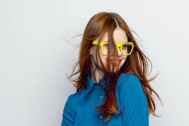 Business woman in blue shirt wearing yellow glasses emotions Business woman in blue shirt wearing yellow glasses emotions. High quality photo Copyright: xx 41254482