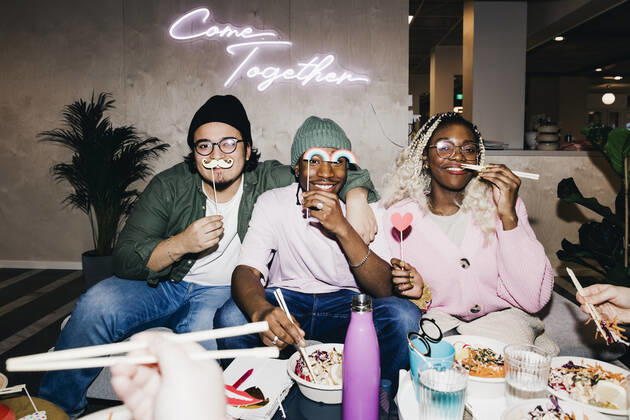Portrait of happy multiracial male and female friends with props having food in college dorm Sweden, Stockholm, model released, property released Copyright: xMaskotx , MA92254
