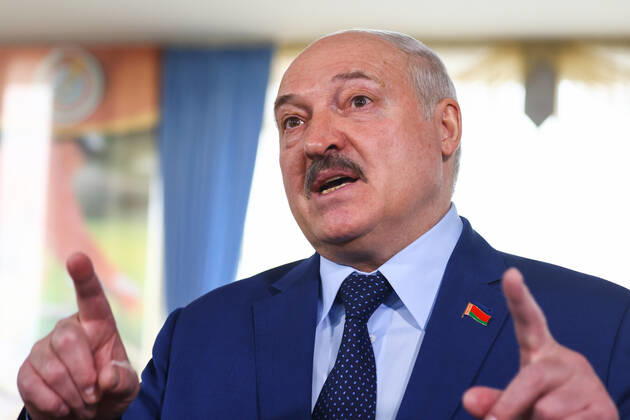 MINSK, BELARUS - FEBRUARY 27, 2022: Belarusian President Alexander Lukashenko talks to reporters at a polling station after casting his vote in the 2022 Belarusian constitutional referendum. In August 2020, mass protests erupted in major cities across Belarus after the results of the 2020 Belarusian presidential election were announced. Belarusian President Lukashenko announced plans for amendments to the constitution and his readiness to redistribute presidential powers to the other branches of government. Peter Kovalev TASS  TS12590C