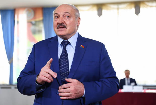 MINSK, BELARUS - FEBRUARY 27, 2022: Belarusian President Alexander Lukashenko talks to reporters at a polling station after casting his vote in the 2022 Belarusian constitutional referendum. In August 2020, mass protests erupted in major cities across Belarus after the results of the 2020 Belarusian presidential election were announced. Belarusian President Lukashenko announced plans for amendments to the constitution and his readiness to redistribute presidential powers to the other branches of government. Peter Kovalev TASS  TS125912