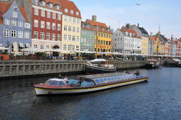 Copenhagen Denmark.10 March 2022 .Torits enjoy sun shine weather boat cruising enjoy food and drinks at cafe adn bars and restaurant on Nyhavn canal in danish capital. (Photo..Francis Dean Dean Pictures)