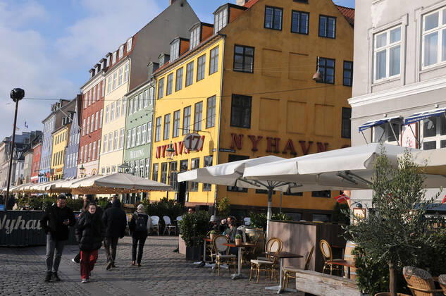 Copenhagen Denmark.10 March 2022 .Torits enjoy sun shine weather boat cruising enjoy food and drinks at cafe adn bars and restaurant on Nyhavn canal in danish capital. (Photo..Francis Dean Dean Pictures)