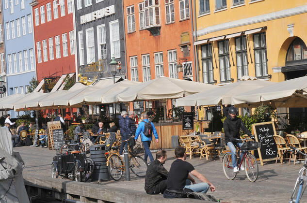 Copenhagen Denmark.22 March 2022 .Torits enjoy sun shine weather boat cruising enjoy food and drinks at cafe adn bars and restaurant on Nyhavn canal in danish capital. (Photo..Francis Dean Dean Pictures)