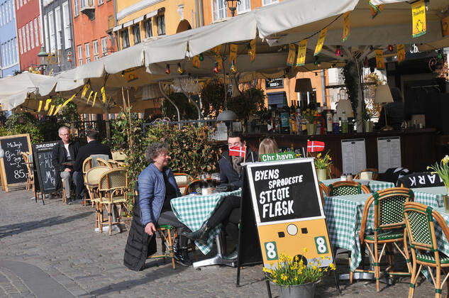 Copenhagen Denmark.22 March 2022 .Torits enjoy sun shine weather boat cruising enjoy food and drinks at cafe adn bars and restaurant on Nyhavn canal in danish capital. (Photo..Francis Dean Dean Pictures)