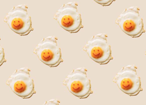 Fried eggs with anthropomorphic smiley faces on yolks, EGHF00373