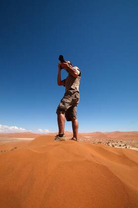 Photographer taking outdoor photos , 2057157.jpg, alone, background, camera, caucasian, desert, digital, equipment, hand, hobby, holding, human, job, journalist, lens, man, namibia, occupation, outdoor, people, person, photo, photograph, photographic, photographing, photography, portrait, professional, sand, shadow, shooting, shot, single, snapshot, sossusvlei, thirsty, top, verticality, winner, winning, young, zoom,
