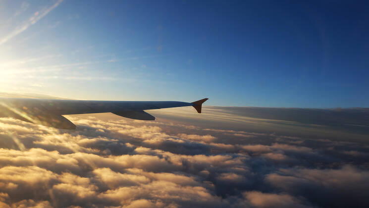 wing of a Airplane at sunset with clouds. Travel, adventure, transport concept. View from the wing window at sunset. , 27241348.jpg, airplane, wing, plane, sky, sunset, view, sunrise, travel, aeroplane, nature, window, flight, aircraft, fly, vacation, high, air, cloud, transportation, transport, above, background, aviation, horizon, aerial, airline, skyline, trip, jet, atmosphere, beautiful, blue, sun, white, scenic, journey, top, cloudy, cloudscape, space, day, over, light, tourism, holiday, bright, technology, set, sunny, flying,