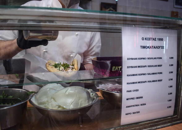 Greece: Popular street food Souvlaki prices soar under inflation A cook prepares the traditional street food Souvlaki in a restaurant while the price board can be seen on the right. The price of Greece s most popular street food soar, as inflation has increased to around 10.7 percent in May from 10.2 percent in April, reaching its highest level in 28 years. Athens Greece Copyright: DimitrisxAspiotis