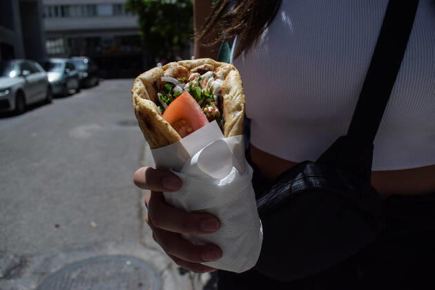 Greece: Popular street food Souvlaki prices soar under inflation A woman holds the traditional street food Souvlaki she has just bought from a restaurant. The price of Greece s most popular street food soar, as inflation has increased to around 10.7 percent in May from 10.2 percent in April, reaching its highest level in 28 years. Athens Greece Copyright: DimitrisxAspiotis