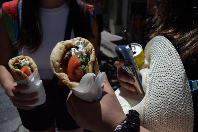 Greece: Popular street food Souvlaki prices soar under inflation Two women hold the traditional street food Souvlaki they have just bought from a restaurant. The price of Greece s most popular street food soar, as inflation has increased to around 10.7 percent in May from 10.2 percent in April, reaching its highest level in 28 years. Athens Greece Copyright: DimitrisxAspiotis