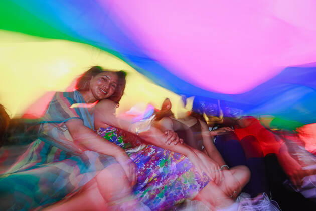 June 11, 2022, Kathmandu, Bagmati, Nepal: Members of LGBTQIA+ communities poses for the photo inside the rainbow flag during Fourth Annual Nepal Pride Parade, Kathmandu. The rainbow flag is a symbol of lesbian, gay, bisexual, transgender (LGBT) and queer pride and LGBT social movements. Kathmandu Nepal - ZUMAm204 20220611_zip_m204_004 Copyright: xAmitxMachamasix