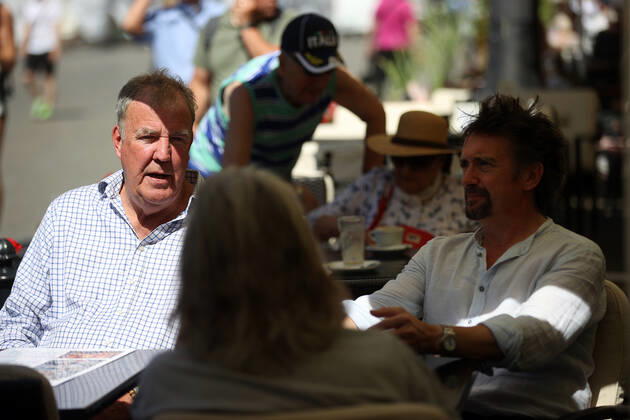 June 24, 2022, Krakow, Poland: The Grand Tour stars, Jeremy Clarkson, Richard Hammond and James May, take coffee on the Main Square in Cracow, Poland, while on tour filming the show. The Grand Tour is a British motoring television series, created by Jeremy Clarkson, Richard Hammond, James May, and Andy Wilman, made for Amazon exclusively for its online streaming service Amazon Prime Video which premiered in 2016. The programme was conceived in the wake of the departure of Clarkson, Hammond, May and Wilman from the BBC series Top Gear. Krakow Poland - ZUMAs197 20220624_zaa_s197_589 Copyright: xVitoxCorleonex