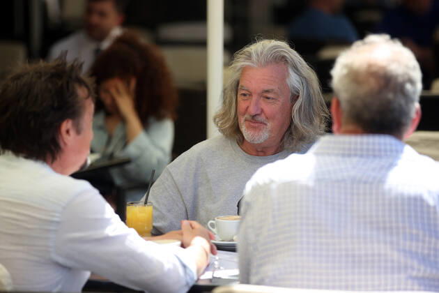 June 24, 2022, Krakow, Poland: The Grand Tour stars, Jeremy Clarkson, Richard Hammond and James May, take coffee on the Main Square in Cracow, Poland, while on tour filming the show. The Grand Tour is a British motoring television series, created by Jeremy Clarkson, Richard Hammond, James May, and Andy Wilman, made for Amazon exclusively for its online streaming service Amazon Prime Video which premiered in 2016. The programme was conceived in the wake of the departure of Clarkson, Hammond, May and Wilman from the BBC series Top Gear. Krakow Poland - ZUMAs197 20220624_zaa_s197_590 Copyright: xVitoxCorleonex
