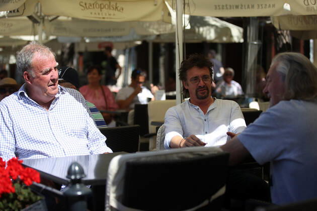 June 24, 2022, Krakow, Poland: The Grand Tour stars, Jeremy Clarkson, Richard Hammond and James May, sit at a coffee shop on the Main Square in Cracow, Poland, while on tour filming the show. The Grand Tour is a British motoring television series, created by Jeremy Clarkson, Richard Hammond, James May, and Andy Wilman, made for Amazon exclusively for its online streaming service Amazon Prime Video which premiered in 2016. The programme was conceived in the wake of the departure of Clarkson, Hammond, May and Wilman from the BBC series Top Gear. Krakow Poland - ZUMAs197 20220624_zaa_s197_603 Copyright: xVitoxCorleonex