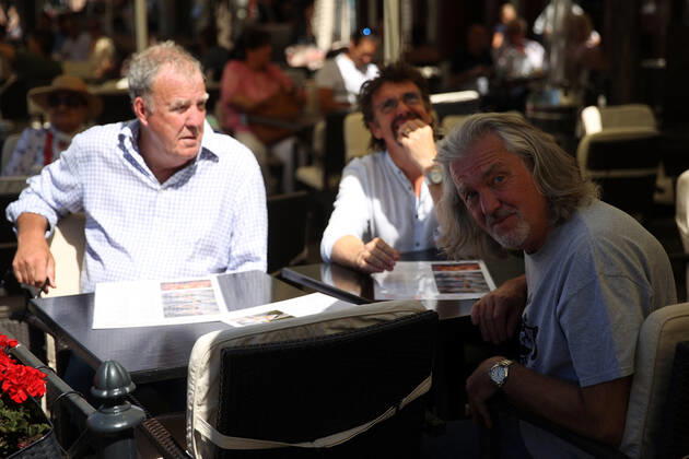 June 24, 2022, Krakow, Poland: The Grand Tour stars, Jeremy Clarkson, Richard Hammond and James May, sit at a coffee shop on the Main Square in Cracow, Poland, while on tour filming the show. The Grand Tour is a British motoring television series, created by Jeremy Clarkson, Richard Hammond, James May, and Andy Wilman, made for Amazon exclusively for its online streaming service Amazon Prime Video which premiered in 2016. The programme was conceived in the wake of the departure of Clarkson, Hammond, May and Wilman from the BBC series Top Gear. Krakow Poland - ZUMAs197 20220624_zaa_s197_605 Copyright: xVitoxCorleonex