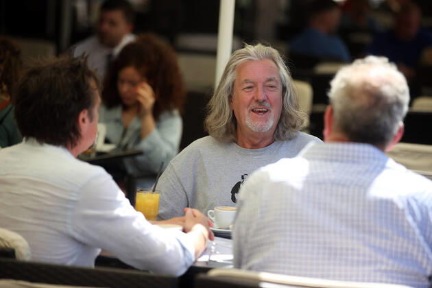June 24, 2022, Krakow, Poland: The Grand Tour stars, Jeremy Clarkson, Richard Hammond and James May, take coffee on the Main Square in Cracow, Poland, while on tour filming the show. The Grand Tour is a British motoring television series, created by Jeremy Clarkson, Richard Hammond, James May, and Andy Wilman, made for Amazon exclusively for its online streaming service Amazon Prime Video which premiered in 2016. The programme was conceived in the wake of the departure of Clarkson, Hammond, May and Wilman from the BBC series Top Gear. Krakow Poland - ZUMAs197 20220624_zaa_s197_608 Copyright: xVitoxCorleonex