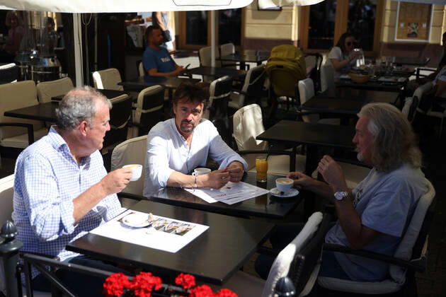 June 24, 2022, Krakow, Poland: The Grand Tour stars, Jeremy Clarkson, Richard Hammond and James May, take coffee on the Main Square in Cracow, Poland, while on tour filming the show. The Grand Tour is a British motoring television series, created by Jeremy Clarkson, Richard Hammond, James May, and Andy Wilman, made for Amazon exclusively for its online streaming service Amazon Prime Video which premiered in 2016. The programme was conceived in the wake of the departure of Clarkson, Hammond, May and Wilman from the BBC series Top Gear. Krakow Poland - ZUMAs197 20220624_zaa_s197_609 Copyright: xVitoxCorleonex