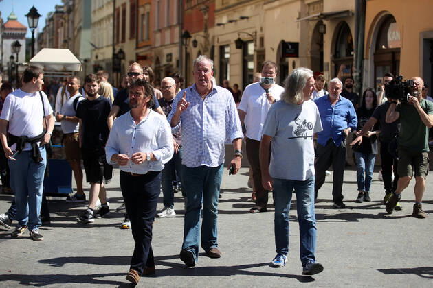 June 24, 2022, Krakow, Poland: The Grand Tour stars, Jeremy Clarkson, Richard Hammond and James May, walk along the Main Square in Cracow, Poland, while on tour filming the show. The Grand Tour is a British motoring television series, created by Jeremy Clarkson, Richard Hammond, James May, and Andy Wilman, made for Amazon exclusively for its online streaming service Amazon Prime Video which premiered in 2016. The programme was conceived in the wake of the departure of Clarkson, Hammond, May and Wilman from the BBC series Top Gear. Krakow Poland - ZUMAs197 20220624_zaa_s197_604 Copyright: xVitoxCorleonex