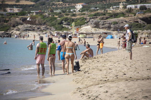 Tourism In Greece - Falassarna Beach In Crete Island Tourism in Greece - The exotic beach of Falassarna at the western side of Crete island. Falasarna bay with 5 beaches with whitish sand and crystal clear transparent tropical turquoise water hosts some of the most famous beaches in Greece, which has been awarded as the best beach of Crete and voted as one of the 10 best beaches in Europe several times in the past. Local people and tourists are seen relaxing, sunbathing, tanning, swimming, doing water sports and walking. Tourism is bouncing back with reservations exceeding the pre-pandemic numbers, putting Greece and the Greek islands on high demand. Tourists travel after the Covid-19 Coronavirus pandemic. Falassarna, Chania, Crete island, Copyright: xNicolasxEconomoux originalFilename: economou-tourismi220614_npNON