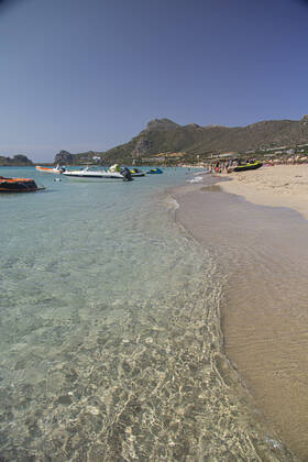 Tourism In Greece - Falassarna Beach In Crete Island Tourism in Greece - The exotic beach of Falassarna at the western side of Crete island. Falasarna bay with 5 beaches with whitish sand and crystal clear transparent tropical turquoise water hosts some of the most famous beaches in Greece, which has been awarded as the best beach of Crete and voted as one of the 10 best beaches in Europe several times in the past. Local people and tourists are seen relaxing, sunbathing, tanning, swimming, doing water sports and walking. Tourism is bouncing back with reservations exceeding the pre-pandemic numbers, putting Greece and the Greek islands on high demand. Tourists travel after the Covid-19 Coronavirus pandemic. Falassarna, Chania, Crete island, Copyright: xNicolasxEconomoux originalFilename: economou-tourismi220614_npqEh