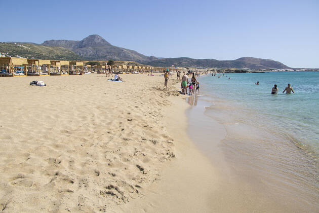 Tourism In Greece - Falassarna Beach In Crete Island Tourism in Greece - The exotic beach of Falassarna at the western side of Crete island. Falasarna bay with 5 beaches with whitish sand and crystal clear transparent tropical turquoise water hosts some of the most famous beaches in Greece, which has been awarded as the best beach of Crete and voted as one of the 10 best beaches in Europe several times in the past. Local people and tourists are seen relaxing, sunbathing, tanning, swimming, doing water sports and walking. Tourism is bouncing back with reservations exceeding the pre-pandemic numbers, putting Greece and the Greek islands on high demand. Tourists travel after the Covid-19 Coronavirus pandemic. Falassarna, Chania, Crete island, Copyright: xNicolasxEconomoux originalFilename: economou-tourismi220614_nprvp