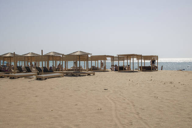 Tourism In Greece - Falassarna Beach In Crete Island Tourism in Greece - The exotic beach of Falassarna at the western side of Crete island. Falasarna bay with 5 beaches with whitish sand and crystal clear transparent tropical turquoise water hosts some of the most famous beaches in Greece, which has been awarded as the best beach of Crete and voted as one of the 10 best beaches in Europe several times in the past. Local people and tourists are seen relaxing, sunbathing, tanning, swimming, doing water sports and walking. Tourism is bouncing back with reservations exceeding the pre-pandemic numbers, putting Greece and the Greek islands on high demand. Tourists travel after the Covid-19 Coronavirus pandemic. Falassarna, Chania, Crete island, Copyright: xNicolasxEconomoux originalFilename: economou-tourismi220614_npzFG