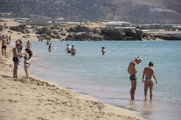 Tourism In Greece - Falassarna Beach In Crete Island Tourism in Greece - The exotic beach of Falassarna at the western side of Crete island. Falasarna bay with 5 beaches with whitish sand and crystal clear transparent tropical turquoise water hosts some of the most famous beaches in Greece, which has been awarded as the best beach of Crete and voted as one of the 10 best beaches in Europe several times in the past. Local people and tourists are seen relaxing, sunbathing, tanning, swimming, doing water sports and walking. Tourism is bouncing back with reservations exceeding the pre-pandemic numbers, putting Greece and the Greek islands on high demand. Tourists travel after the Covid-19 Coronavirus pandemic. Falassarna, Chania, Crete island, Copyright: xNicolasxEconomoux originalFilename: economou-tourismi220614_nprzd