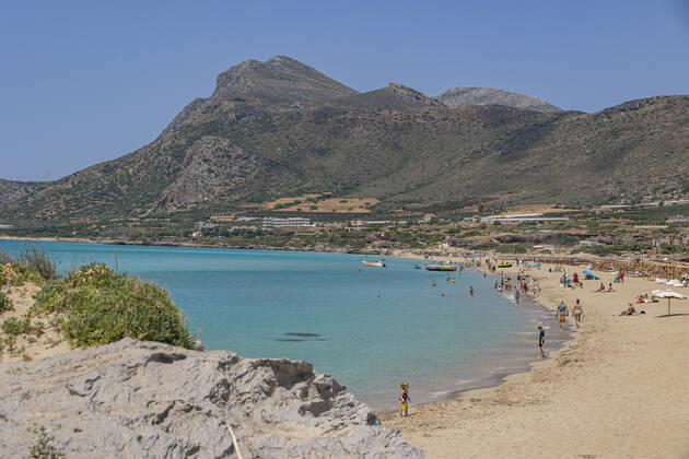 Tourism In Greece - Falassarna Beach In Crete Island Tourism in Greece - The exotic beach of Falassarna at the western side of Crete island during a high-temperature day, heatwave. Falasarna bay with 5 beaches made of whitish sand and crystal clear transparent tropical turquoise water hosts some of the most famous beaches in Greece, which has been awarded multiple times as the best beach of Crete and voted as one of the 10 best beaches in Europe several times in the past. Local people and tourists are seen relaxing, sunbathing, tanning, swimming, doing water sports and walking. Tourism is bouncing back with reservations overpassing the pre-pandemic numbers, putting Greece and the Greek islands on high demand. Tourists travel after the Covid Copyright: xNicolasxEconomoux originalFilename: economou-tourismi220818_npOEi