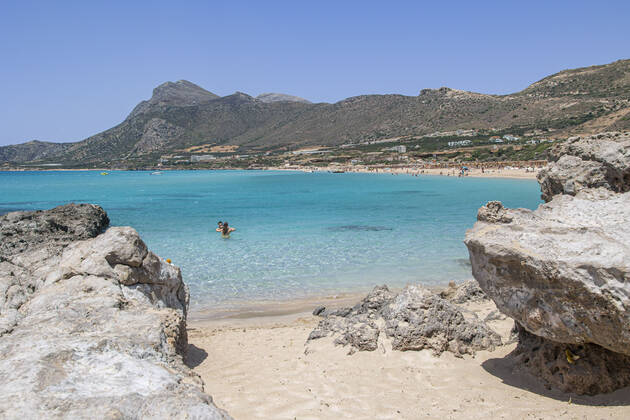 Tourism In Greece - Falassarna Beach In Crete Island Tourism in Greece - The exotic beach of Falassarna at the western side of Crete island during a high-temperature day, heatwave. Falasarna bay with 5 beaches made of whitish sand and crystal clear transparent tropical turquoise water hosts some of the most famous beaches in Greece, which has been awarded multiple times as the best beach of Crete and voted as one of the 10 best beaches in Europe several times in the past. Local people and tourists are seen relaxing, sunbathing, tanning, swimming, doing water sports and walking. Tourism is bouncing back with reservations overpassing the pre-pandemic numbers, putting Greece and the Greek islands on high demand. Tourists travel after the Covid Copyright: xNicolasxEconomoux originalFilename: economou-tourismi220818_npPRw