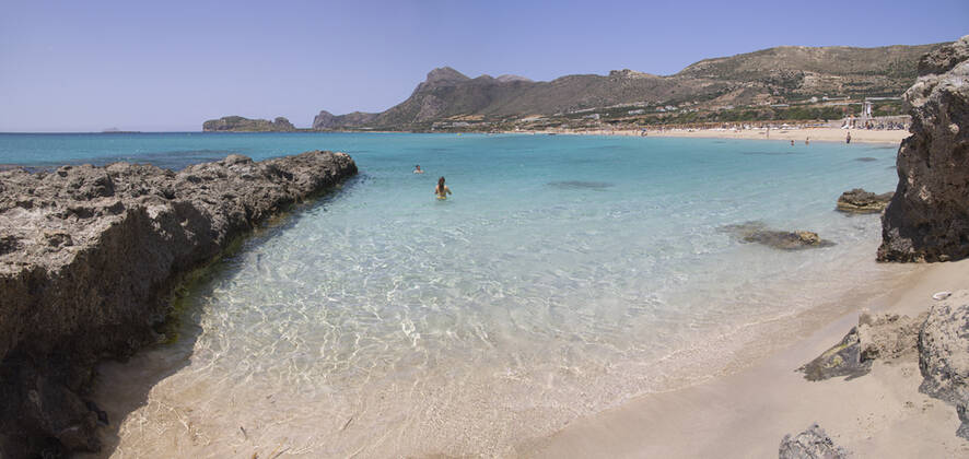 Tourism In Greece - Falassarna Beach In Crete Island Tourism in Greece - The exotic beach of Falassarna at the western side of Crete island during a high-temperature day, heatwave. Falasarna bay with 5 beaches made of whitish sand and crystal clear transparent tropical turquoise water hosts some of the most famous beaches in Greece, which has been awarded multiple times as the best beach of Crete and voted as one of the 10 best beaches in Europe several times in the past. Local people and tourists are seen relaxing, sunbathing, tanning, swimming, doing water sports and walking. Tourism is bouncing back with reservations overpassing the pre-pandemic numbers, putting Greece and the Greek islands on high demand. Tourists travel after the Covid Copyright: xNicolasxEconomoux originalFilename: economou-tourismi220818_npQEQ