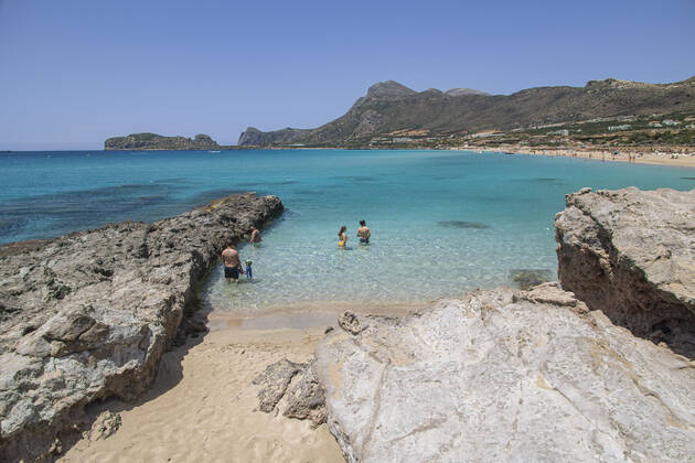 Tourism In Greece - Falassarna Beach In Crete Island Tourism in Greece - The exotic beach of Falassarna at the western side of Crete island during a high-temperature day, heatwave. Falasarna bay with 5 beaches made of whitish sand and crystal clear transparent tropical turquoise water hosts some of the most famous beaches in Greece, which has been awarded multiple times as the best beach of Crete and voted as one of the 10 best beaches in Europe several times in the past. Local people and tourists are seen relaxing, sunbathing, tanning, swimming, doing water sports and walking. Tourism is bouncing back with reservations overpassing the pre-pandemic numbers, putting Greece and the Greek islands on high demand. Tourists travel after the Covid Copyright: xNicolasxEconomoux originalFilename: economou-tourismi220818_npzmf