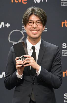 Kawamura s Hyakka wins San Sebastian best director award Japanese film director Genki Kawamura poses at San Sebastian Film Festival in Spain s San Sebastian on Sept. 24, 2022, after his Hyakka (A Hundred Flowers) won Silver Shell for Best Director.  A14AA0001339562P