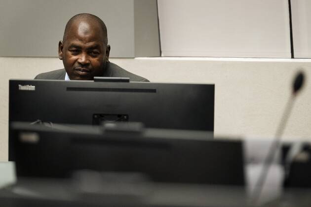 2022-09-26 09:32:48 Mahamat Said Abdel Kani takes his seat in the court room of the International Criminal Court in The Hague, Netherlands, Monday, Sept. 26, 2022. The trial of an alleged commander in a mainly Muslim rebel group from Central African Republic opened and charged Said with crimes against humanity and war crimes. (AP Photo Peter Dejong, Pool) netherlands out - belgium out