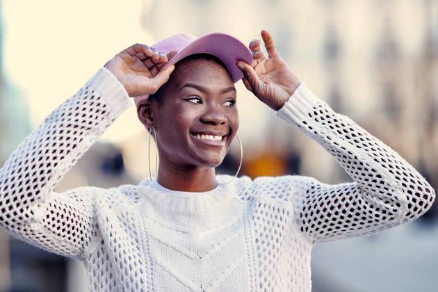 Cheerful young woman wearing pink cap model released, Symbolfoto, GGGF01180